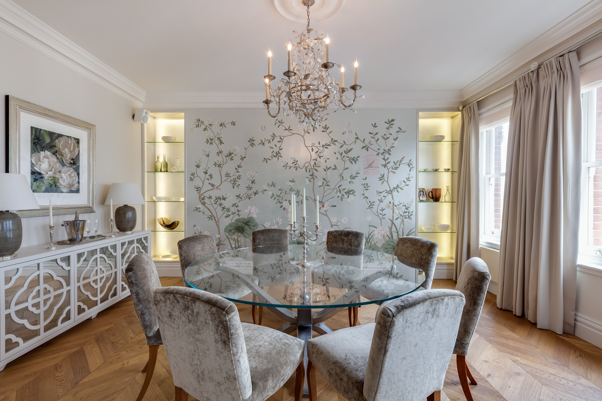 Luxury pastel dining room with De Gournay wallpaper and classical pendant light