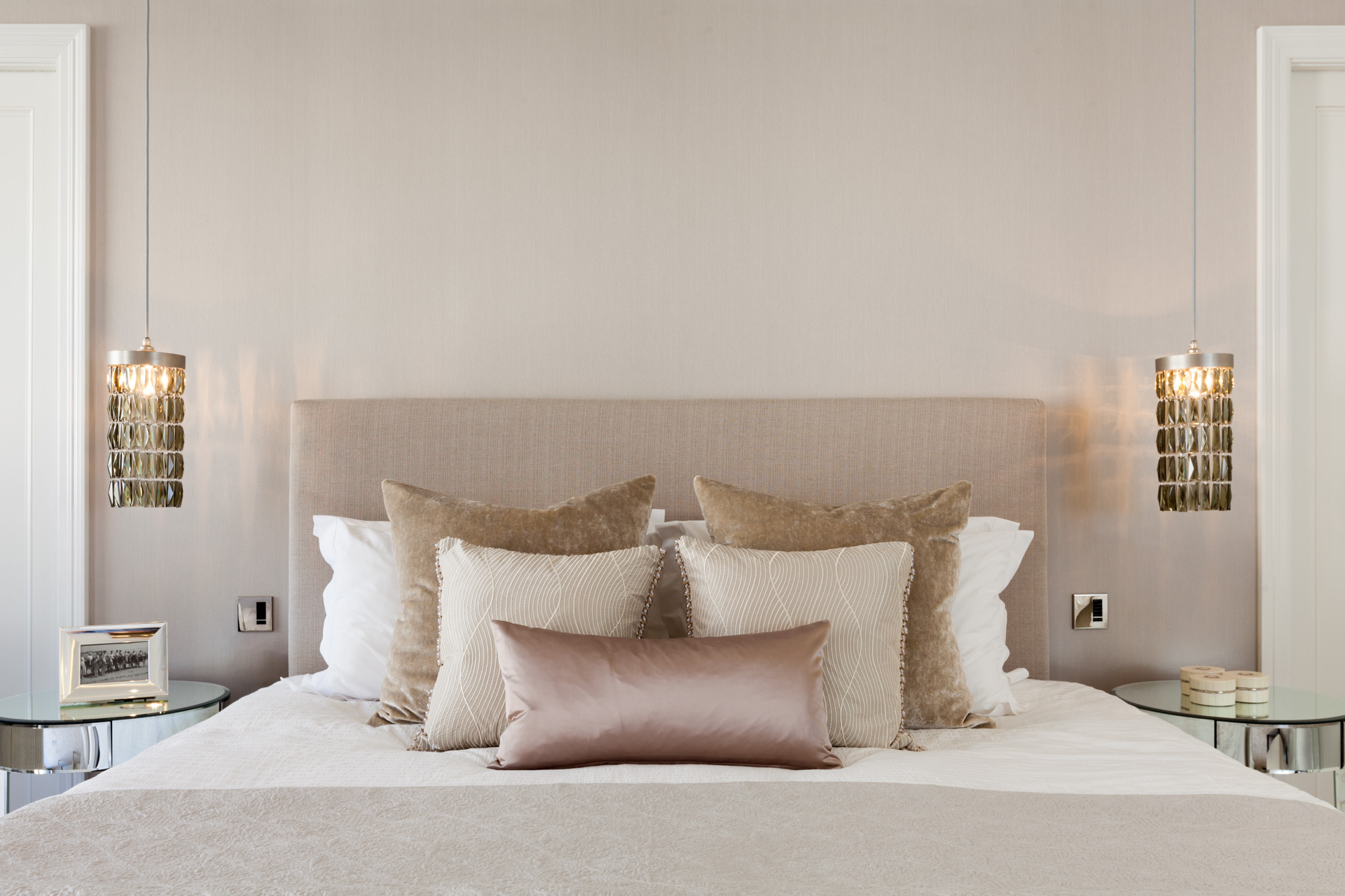 neutral pastel bedroom with pendants