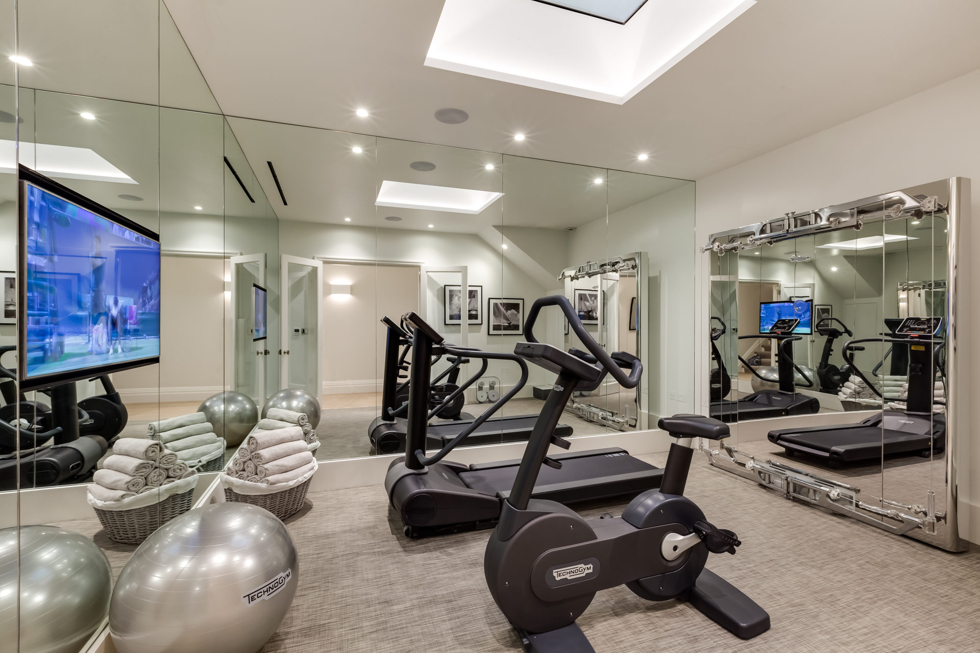 At home gym with treadmill and bike