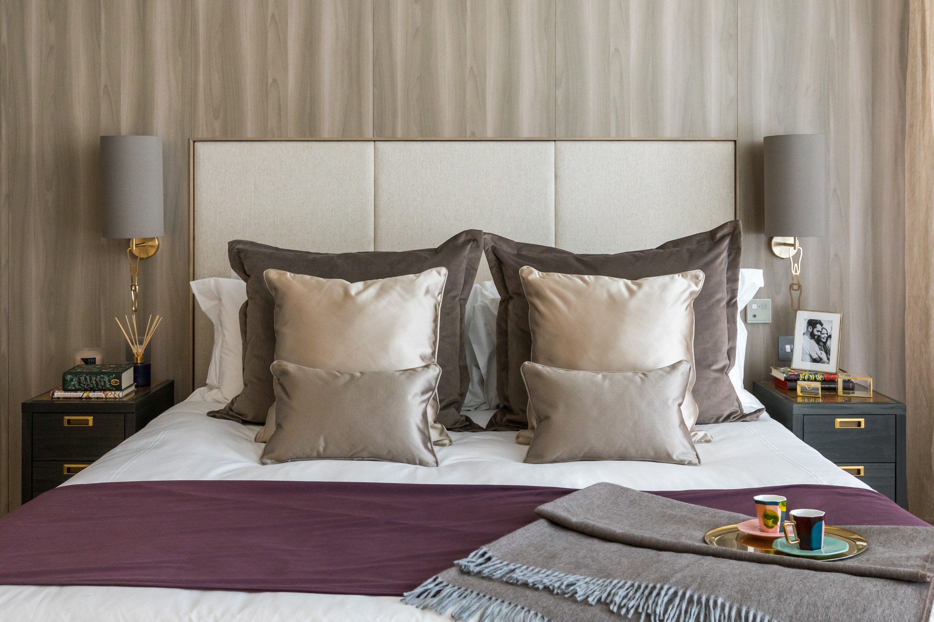 Contemporary hotel room design with grey and purple