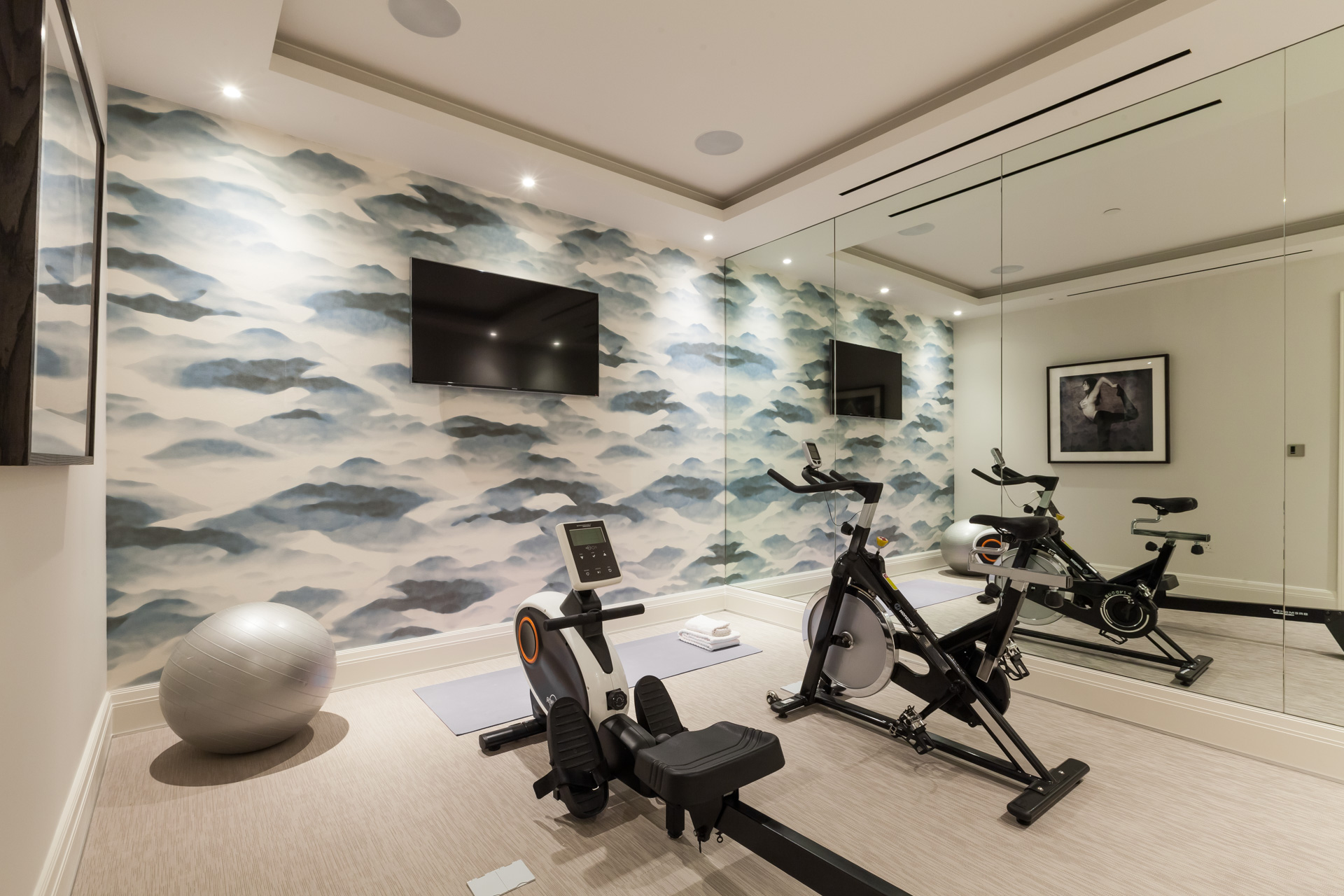 private gym room with cloud wallpaper and recessed ceiling
