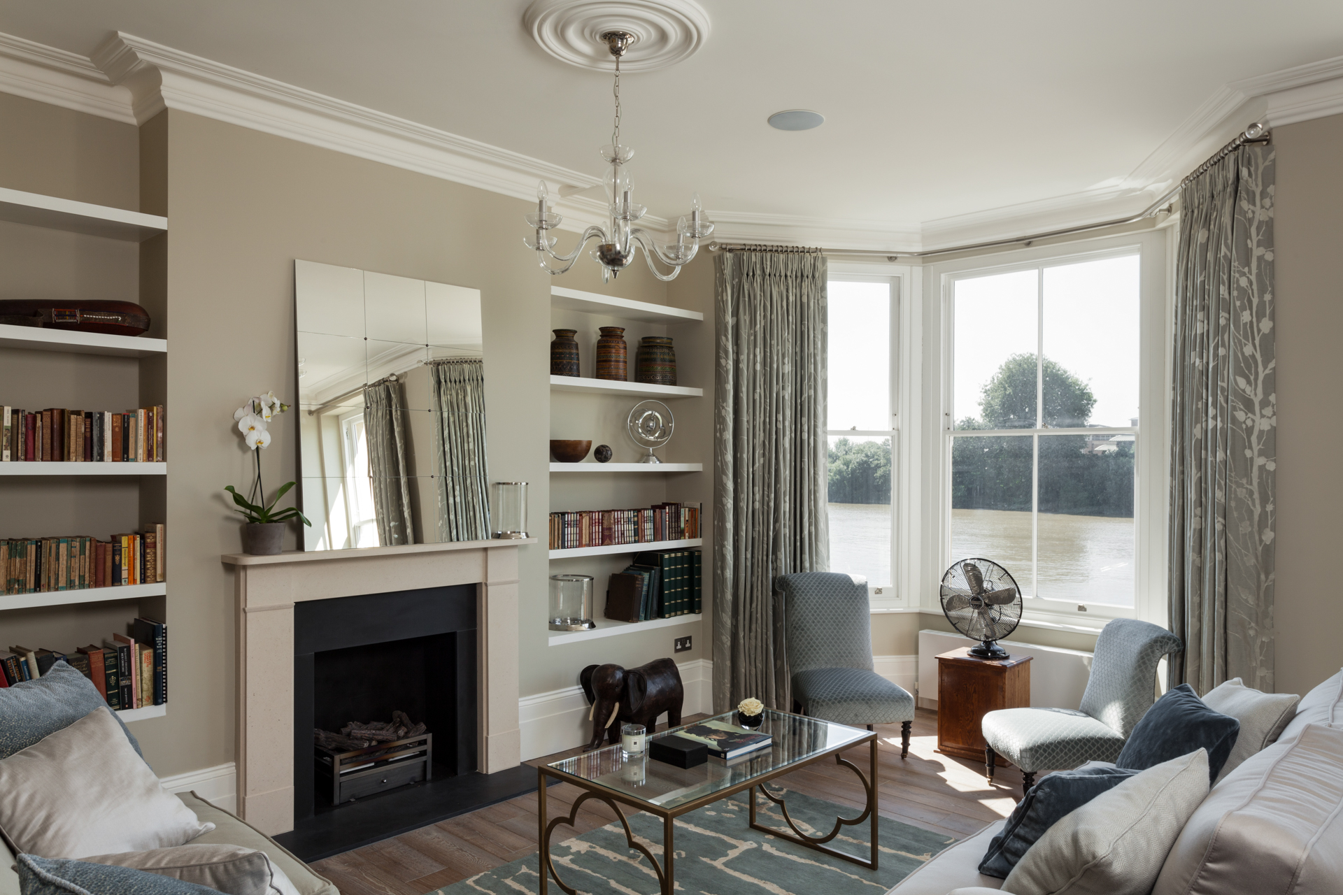 Teal blue and taupe living room with wooden floor
